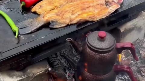 Grilled Trout on Barbecue stone