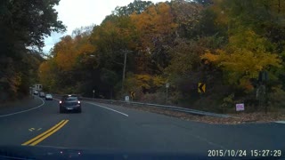 Distracted driver crosses into oncoming traffic