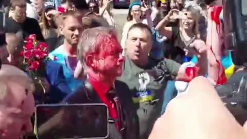 Russian Ambassador Hit with Red Paint at Poland Victory Day Event