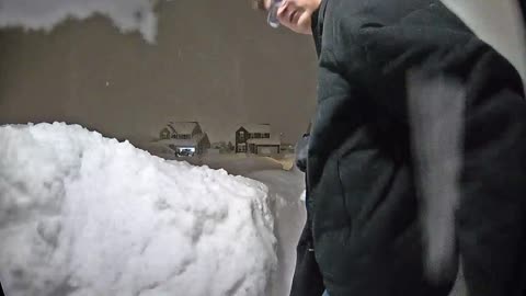 Man Groans After Snow Pile Collapses