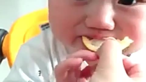 A baby's first taste of lemon