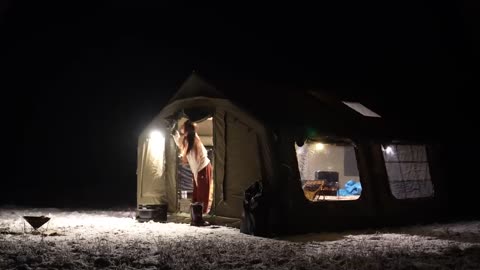 Camping in -20°C winter snowstorm an inflatable tent comfortable as home
