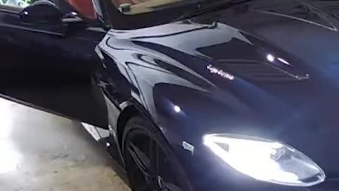 Thieves force a man out of his Aston Martin and steal it out of his garage.