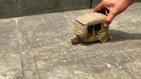 Drive the Muddy Toy Vehicle by hand and threw it into the water for cleaning