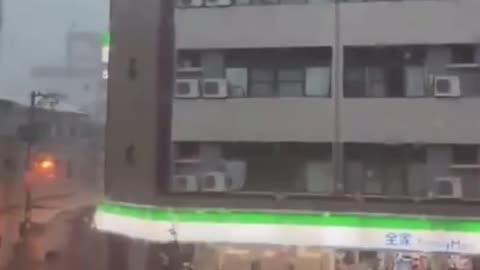 Part of a roof falls on a car