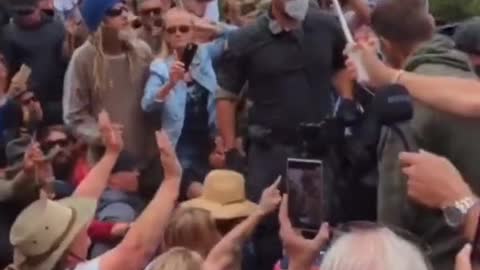 Brain washed cops try to manhandle an elderly protestor. This is insanity...