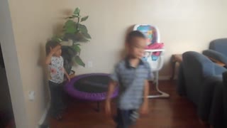 boy demonstrates comically how to use an exercise ball