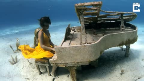 Free Diver Plays Underwater Piano