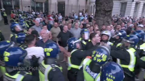 Shocking footage shows metropolitan police walking up to a protester, minding