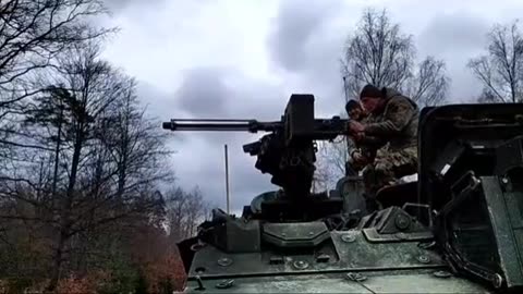 Ukrainian Fires Machine Gun From Atop a Stryker IFV