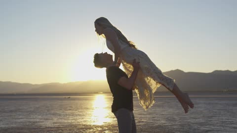 Couple Dancing On Sunset Background