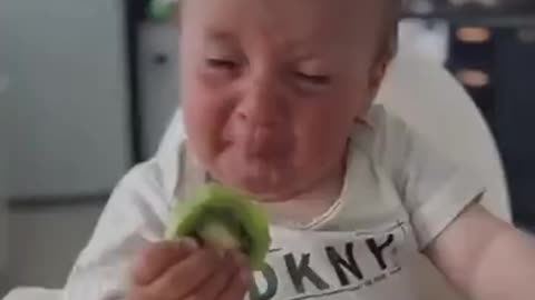 A Baby and Kiwifruit