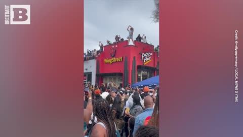 Concertgoers Dance on Top of Pizza Hut at Los Angeles Juneteenth Festival