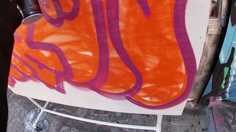 graffiti on canvas outside of scrapyard NYC | yukon graffiti