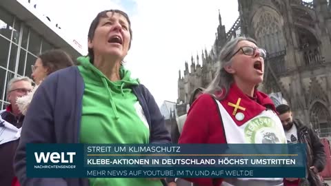 KLIMASCHUTZ-STREIT Wir Werden weitermachen - Klebe-Aktion in Deutschland höchst umstritten