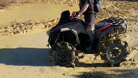 ATV Falls Over in Mud Puddle