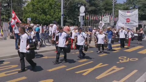 The Swiss freedom clock ringers have arrived outside the WHO