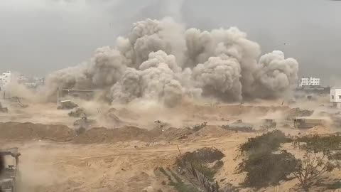 The IDF Israel forces blowing up a building in Gaza.