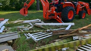 Kubota L2501 with BH77 backhoe and 5 year old taking deck apart