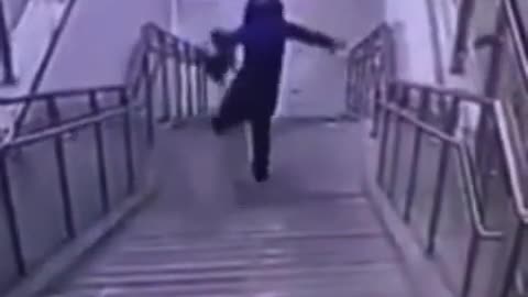 woman fall down a flight of stairs