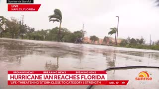 Australian camera operator drops camera to help people fleeing Hurricane Ian