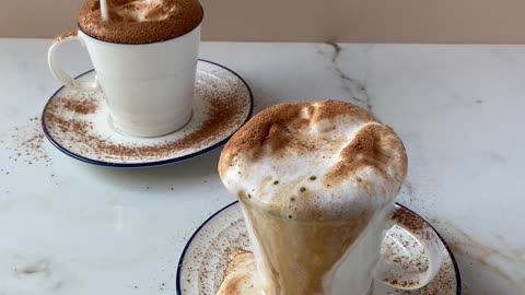 Pouring milk into a coffee