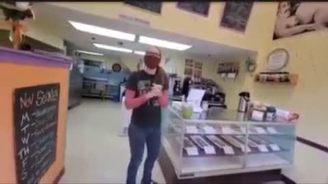 Two women fight over masks mandated in a cookie shop
