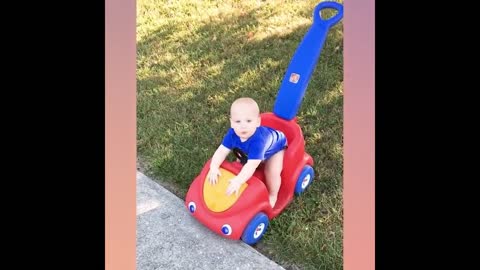 The baby plays on the slide