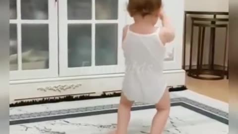 a baby dancing on dam to cosita song