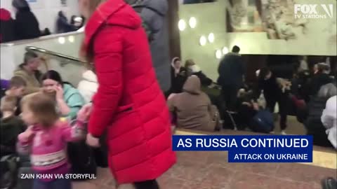 People take shelter at a subway station in Ukraine amid Russian invasion