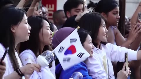 WATCH_ BTS' Jin carries Olympic torch in Paris.mp4