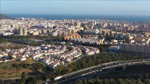 discovering malaga city after flying over some trees sunny day spain
