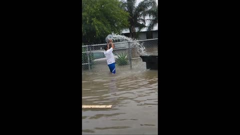 Guy Fails to Stop Flash Flood With Bucket