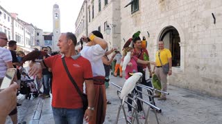 People Amazed By lutino cockatiels With Owner In Street