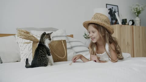 A Girl Looking at the Cat