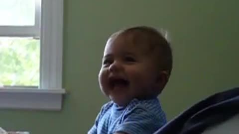 Cute baby laugh very much when he hear his mother voice