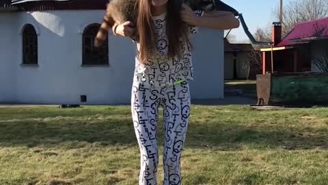 Russian Works Out with Her Raccoon