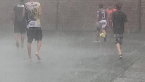 Playing Football In The Pouring Rain