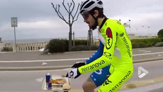 Cyclist has sit down lunch on the go