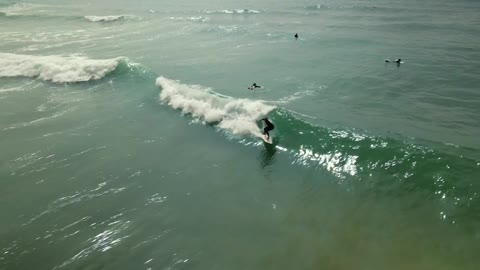 Man gets Caught by a Wave on a Surfboard