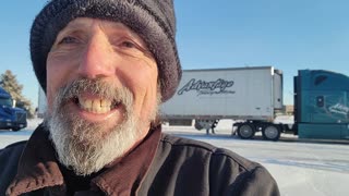 EIGHT DEGREES IN SIDNEY, NE: SNOW AND ICE COVERED TRUCK AND TRAILER