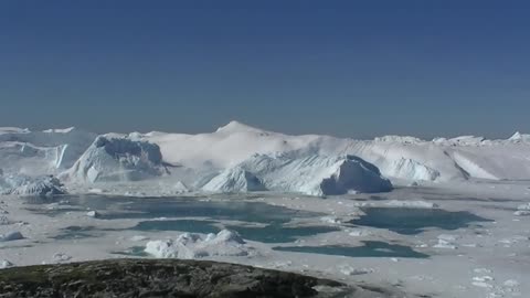 Glacier calving and tsunami wave caught on camera