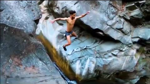 Man jumping into river just like a hero