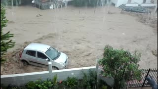 Extreme flooding in Greece sends cars into the sea