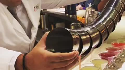 Unreal bartender pours 8 cocktails at once