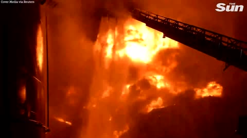 Ukrainian firefighters battle HUGE blaze at oil depot after Russian airstrikes