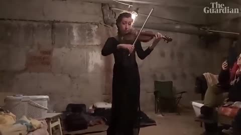 Violinist plays in bomb shelter for displaced Ukraine residents