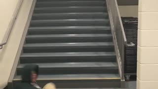 Guy front flip spin black jacket off of stairs hits floor