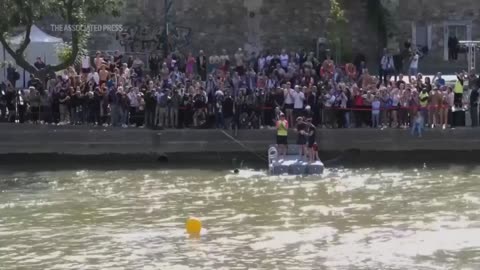 Paris mayor swims in the Seine River to showcase its improved cleanliness before the Olympics