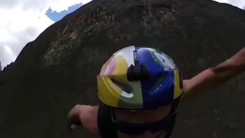 Cyclist rushes down a cliff